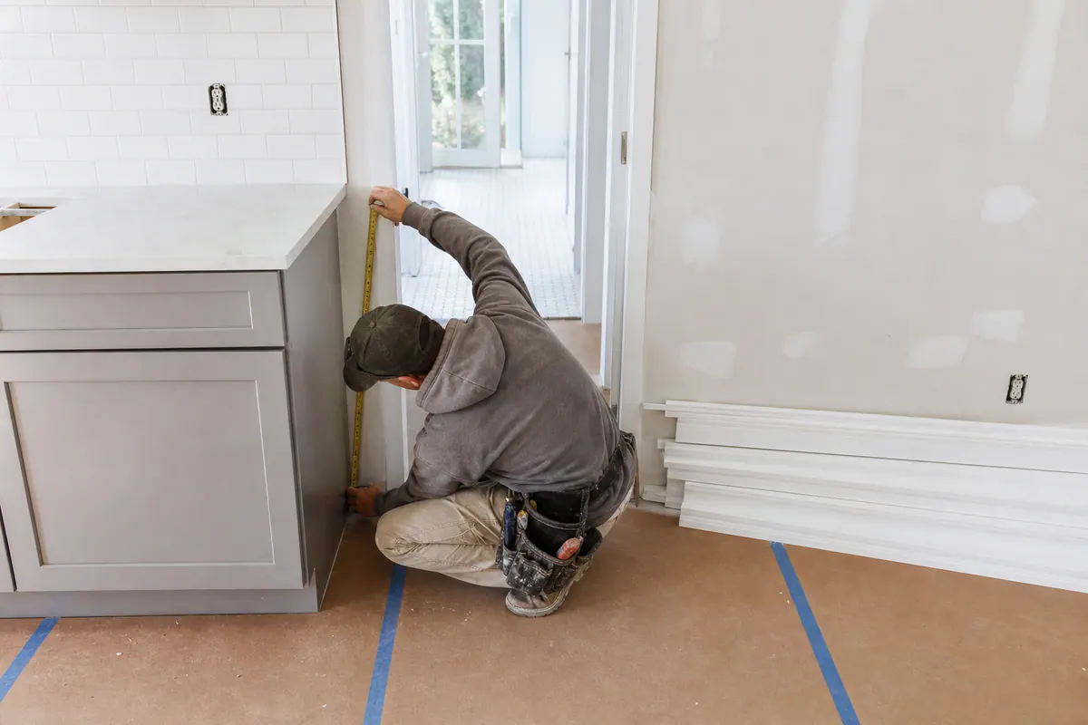 Trim Sequenced Around Cabinets and Tile